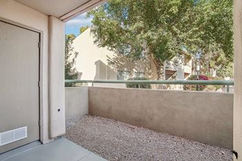 A view of a courtyard with a closed door.